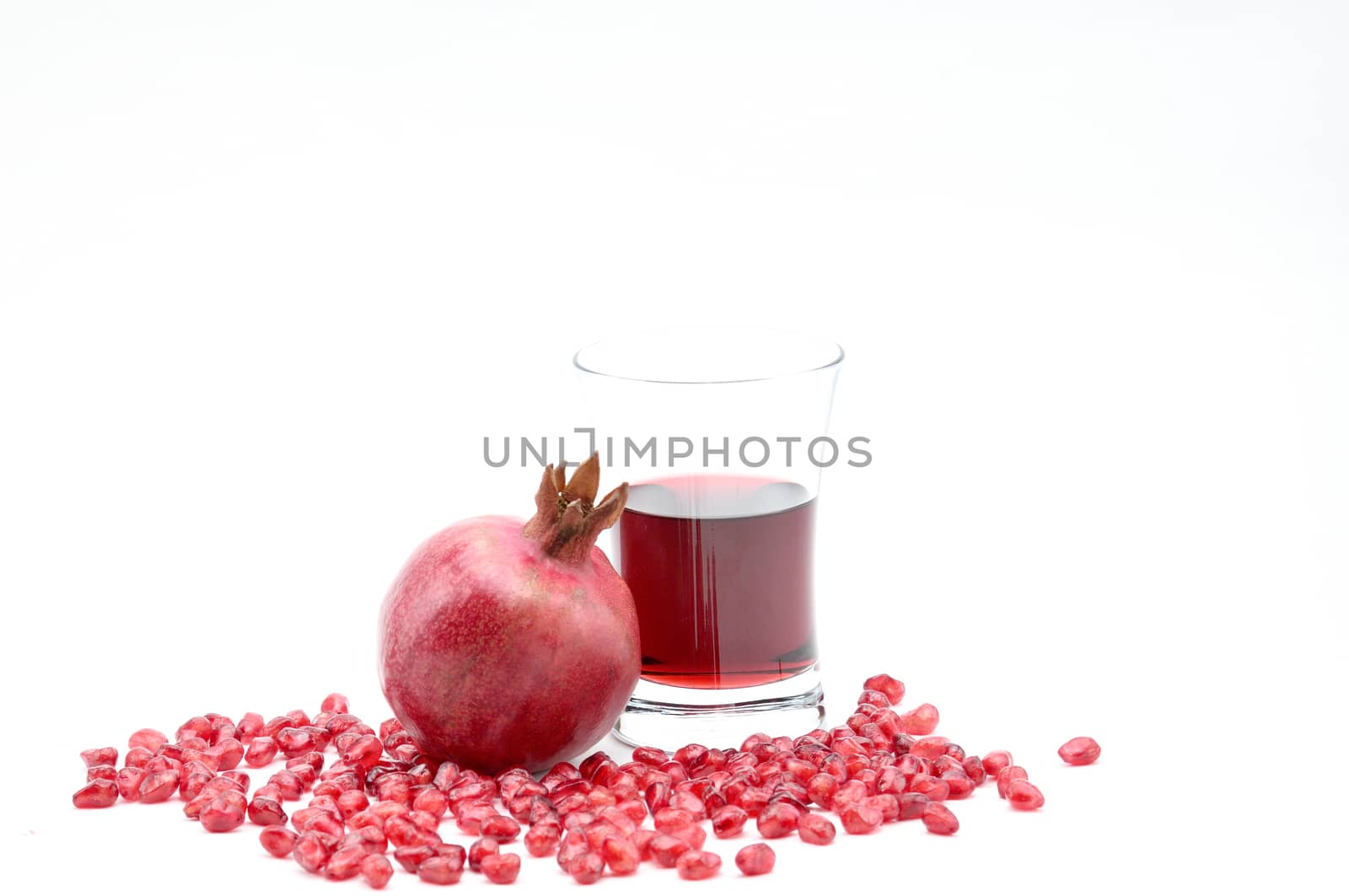 Pomegranate on a white background.Natural.For Isolation. by moviephoto