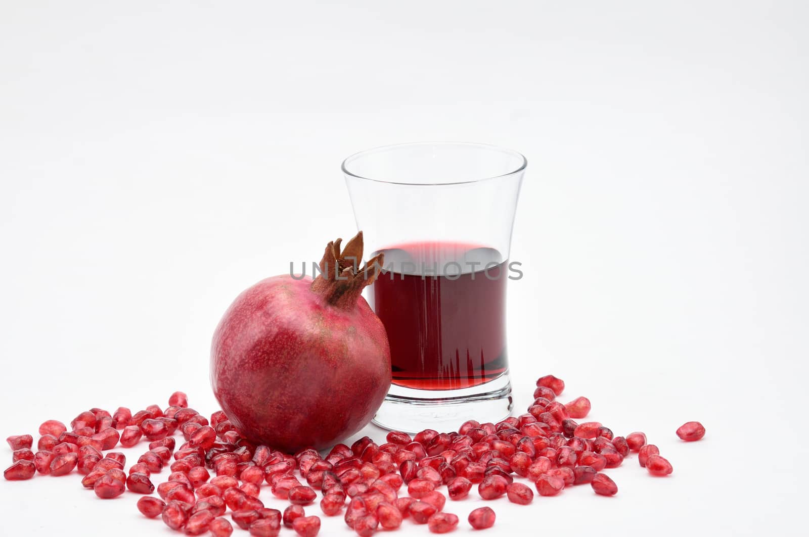 Pomegranate on a white background.Natural.For Isolation. by moviephoto