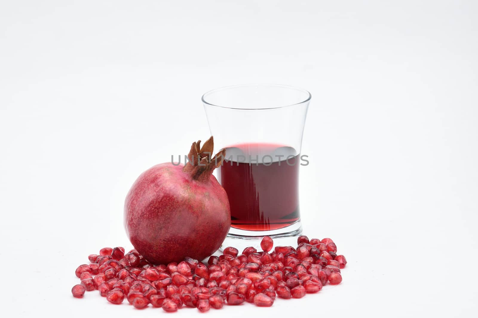 Pomegranate on a white background.Natural.For Isolation. by moviephoto