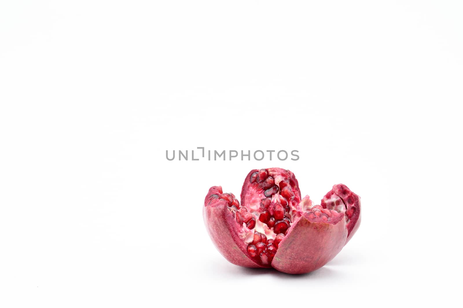 Pomegranate on a white background.Natural.For Isolation. by moviephoto