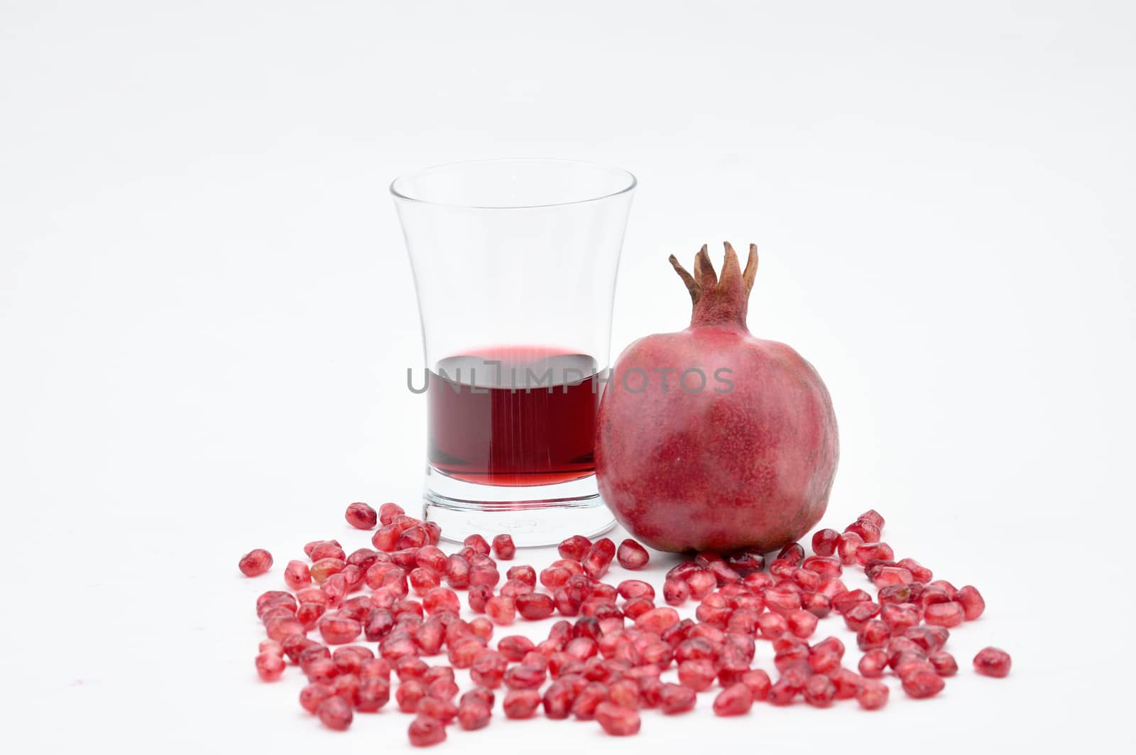 Pomegranate on a white background.Natural.For Isolation. by moviephoto