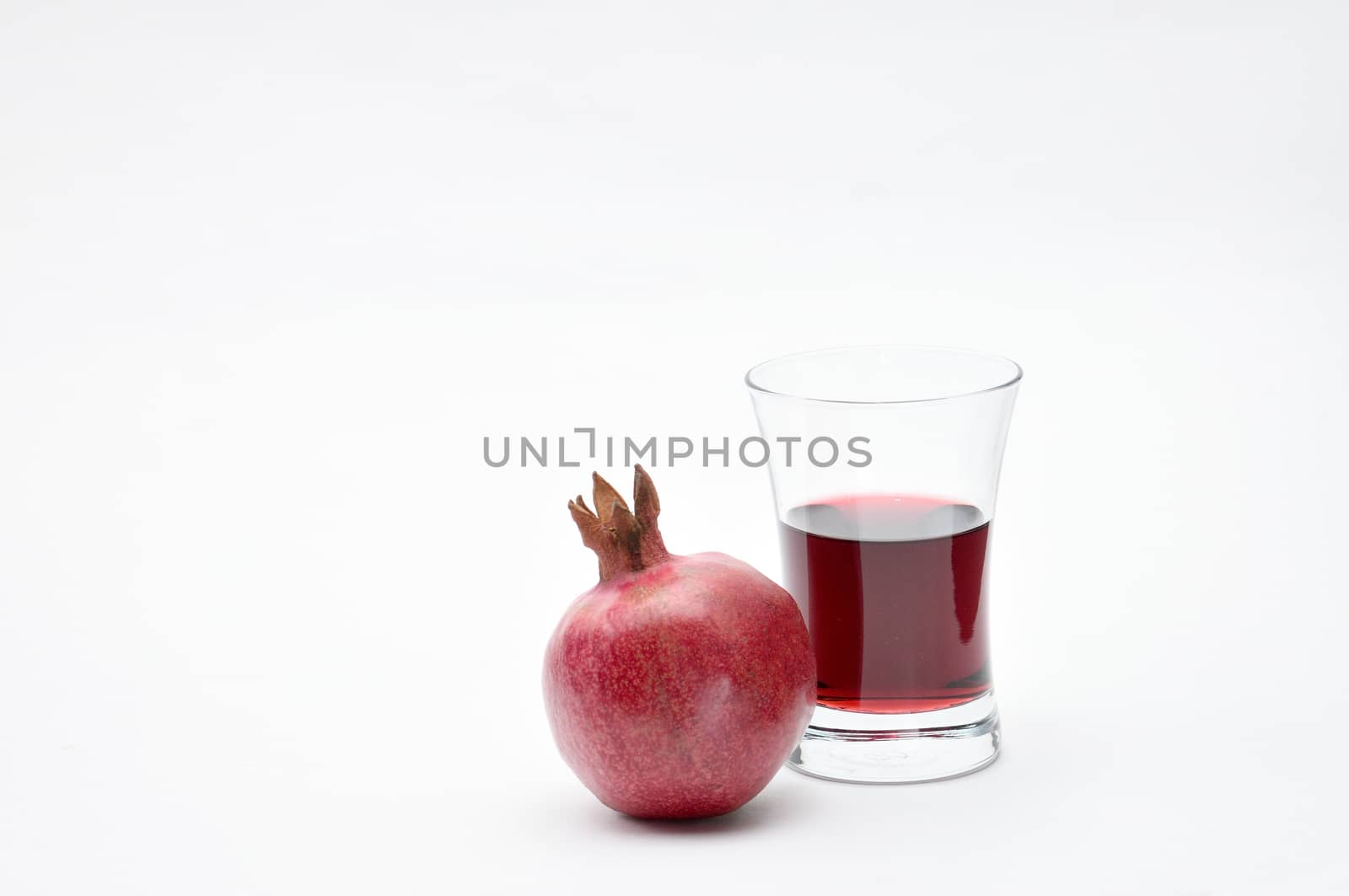 Pomegranate on a white background.Natural.For Isolation. by moviephoto