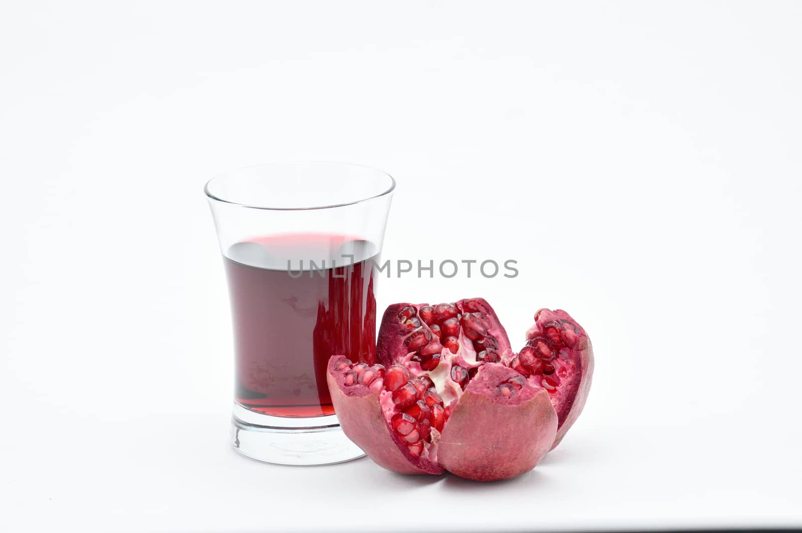 Pomegranate on a white background.Natural.For Isolation. by moviephoto