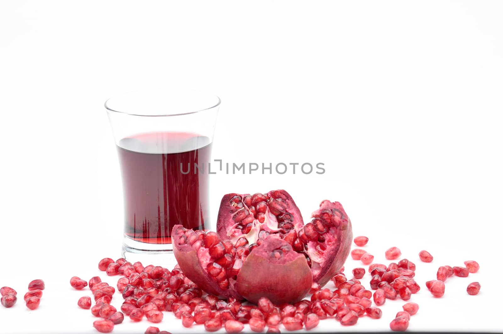 Pomegranate on a white background.Natural.For Isolation. by moviephoto