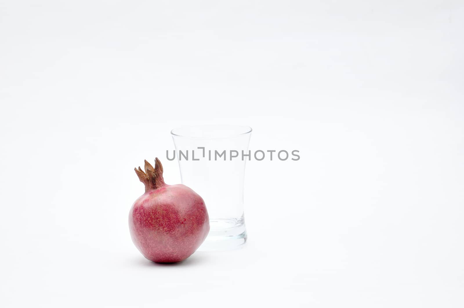 Pomegranate on a white background.Natural.For Isolation. by moviephoto