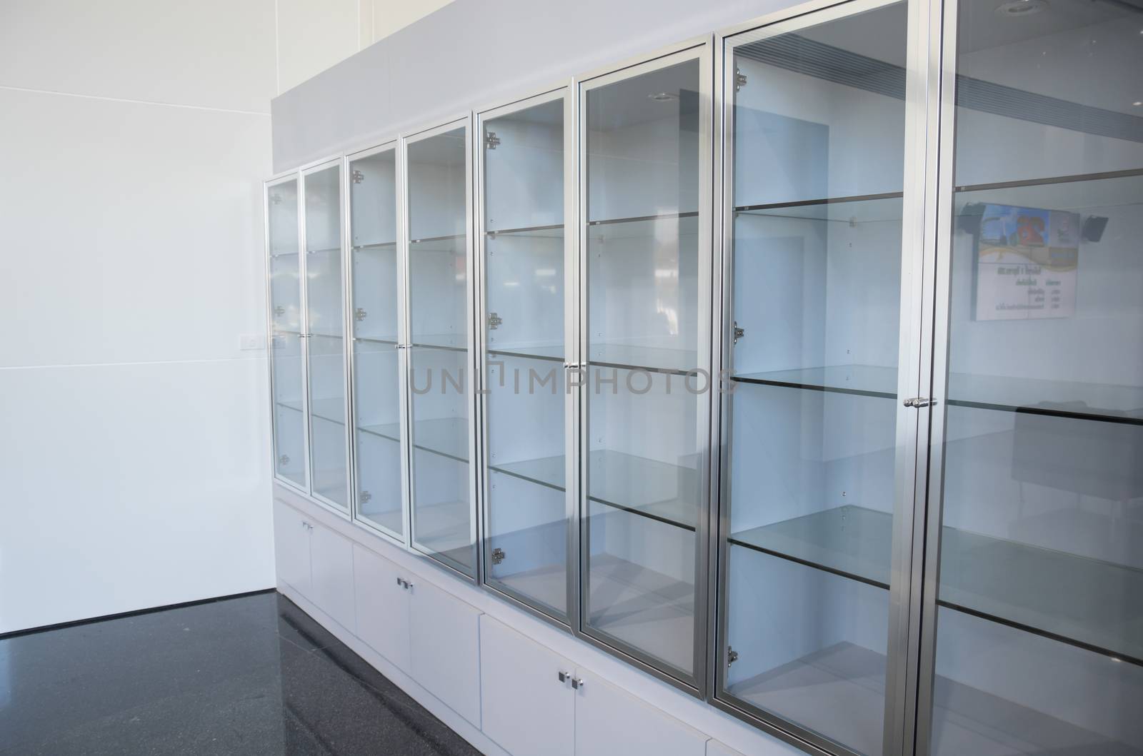 Glass showcase. Glossy feed products. Presentation.