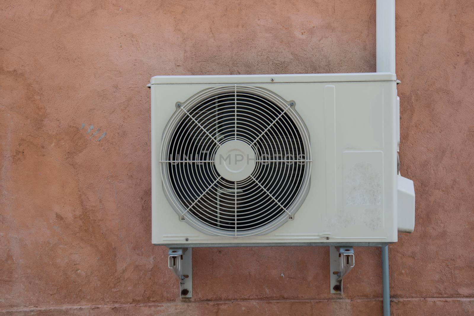air compressor on the vintage brick wall
