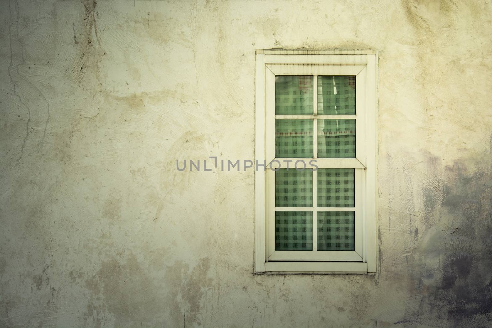 light on Vintage window on nice color cement wall can be used for background