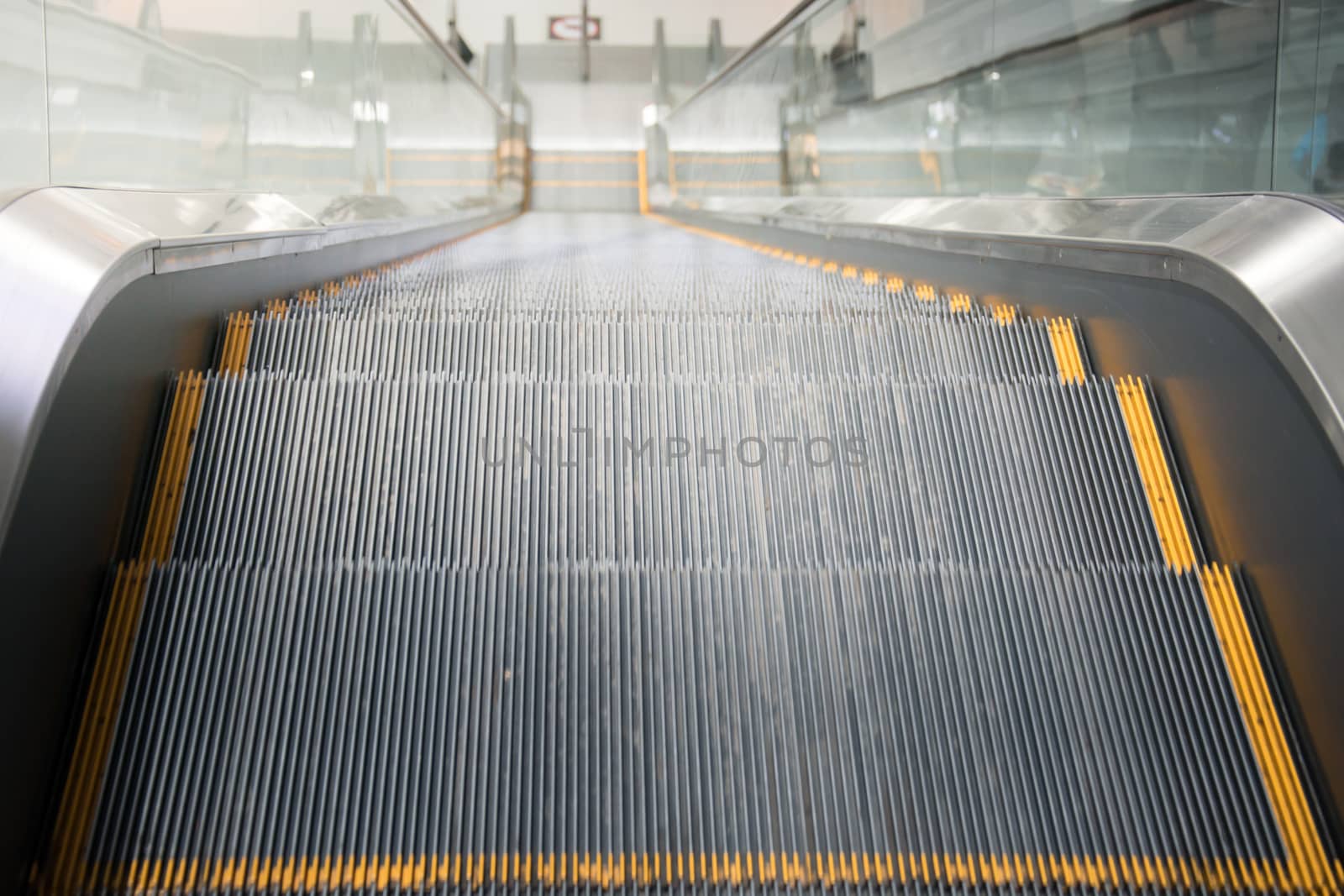 Escalator stairs in station.
