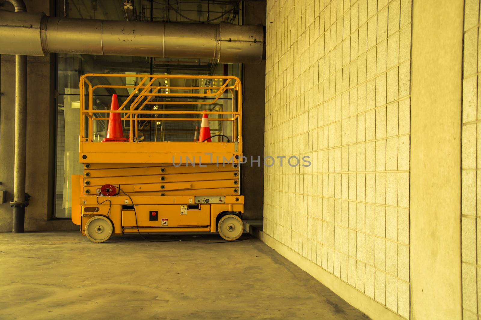 distribution warehouse hall with hydraulic scissors lift platform, vintage color style