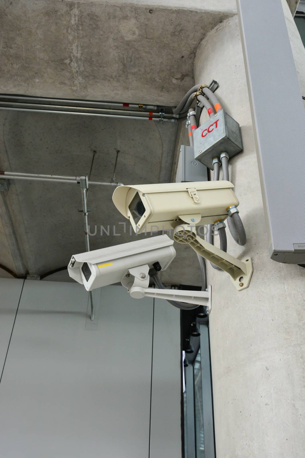 CCTV camera or surveillance operating with electric door in back