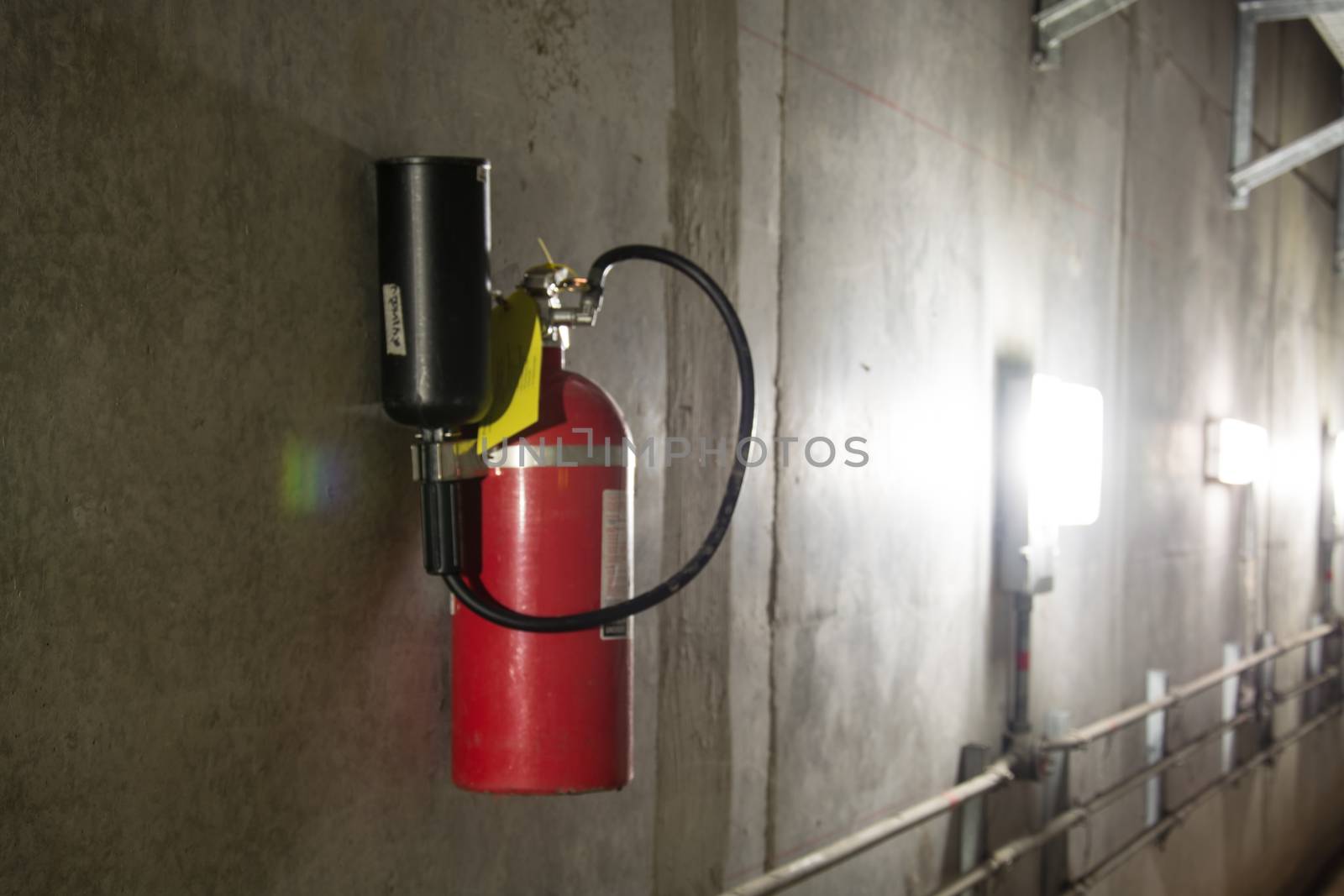 Fire extinguisher in dimly lit corridor Fire safety underground