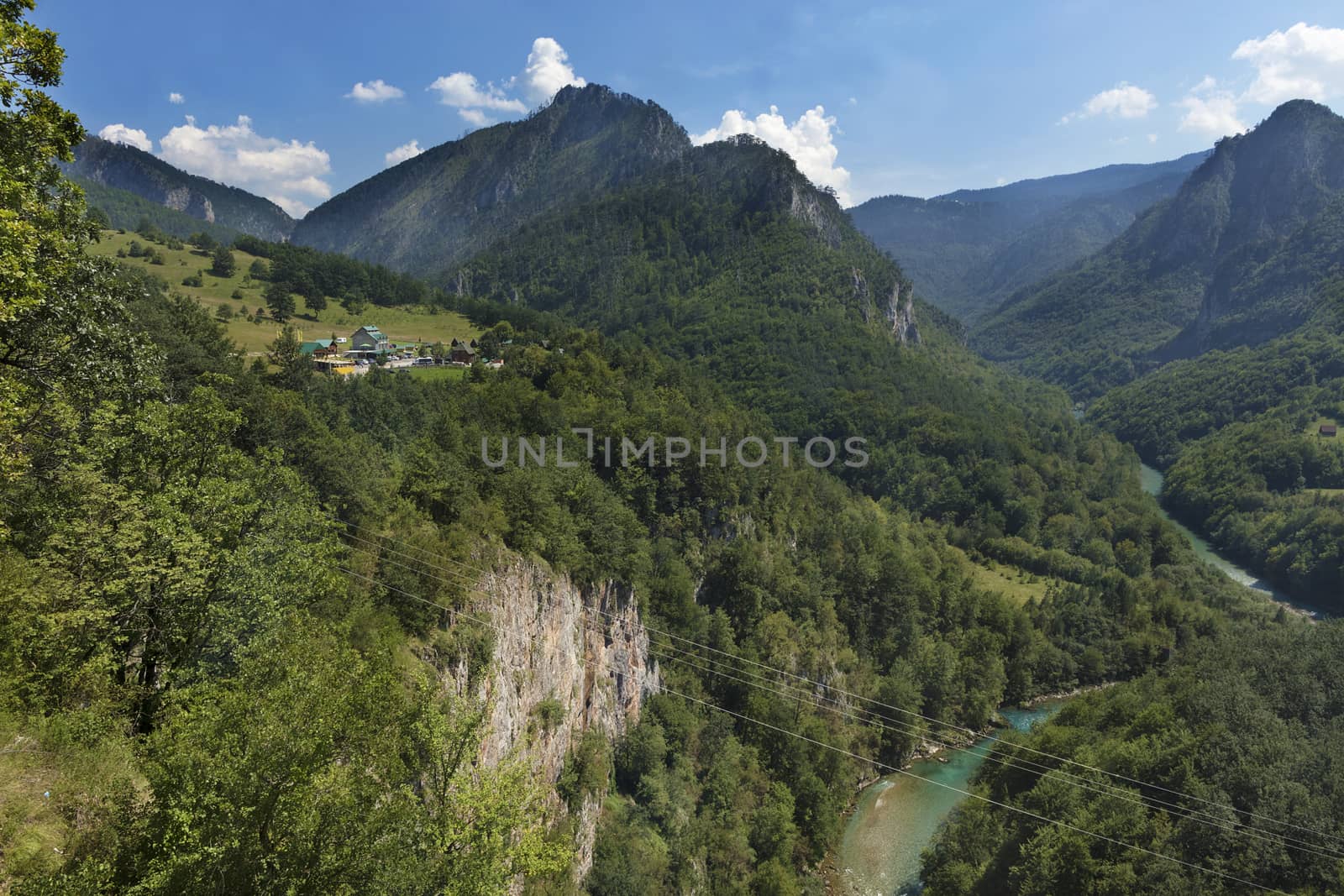 At the top of a high cliff in the mountains of Montenegro there is a small village, a mountain river flows through the gorge and brings clean water and coolness.