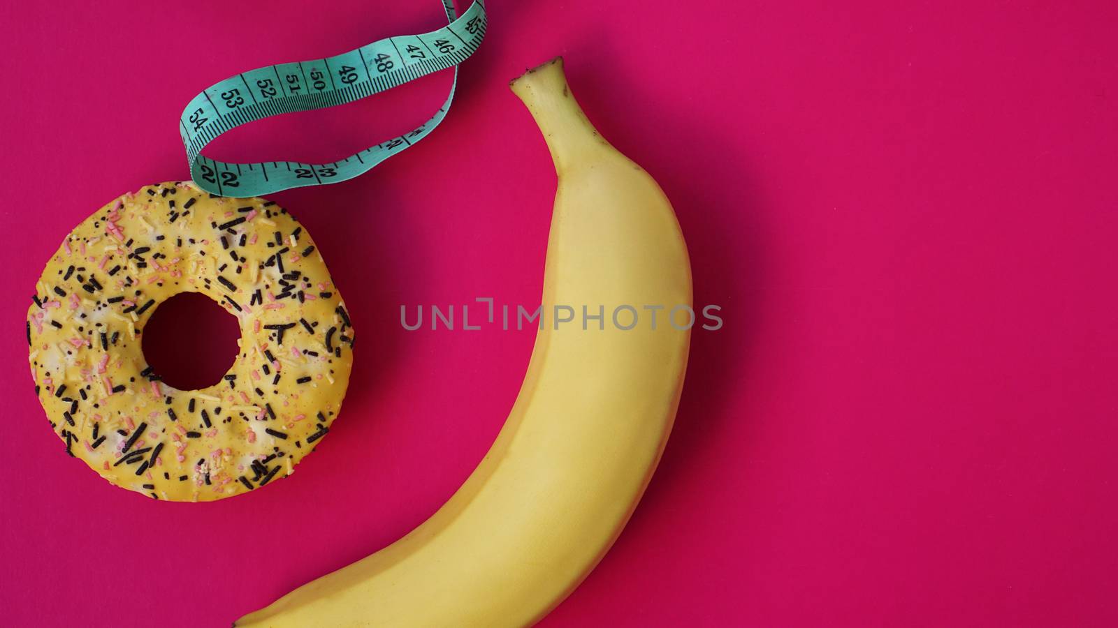 Two types of food, healthy and unhealthy, banana and donut, diet and obesity by natali_brill
