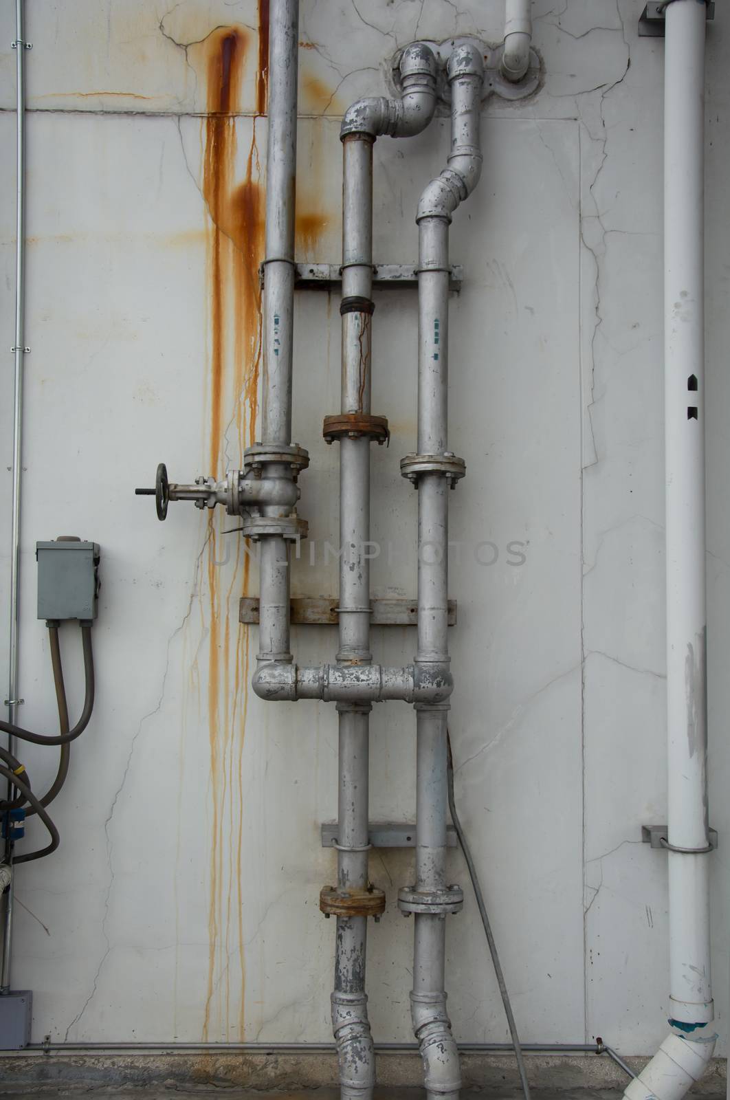 grunge iron pipeline and plumbing connection joints with industrial tap fittings, faucets and valve