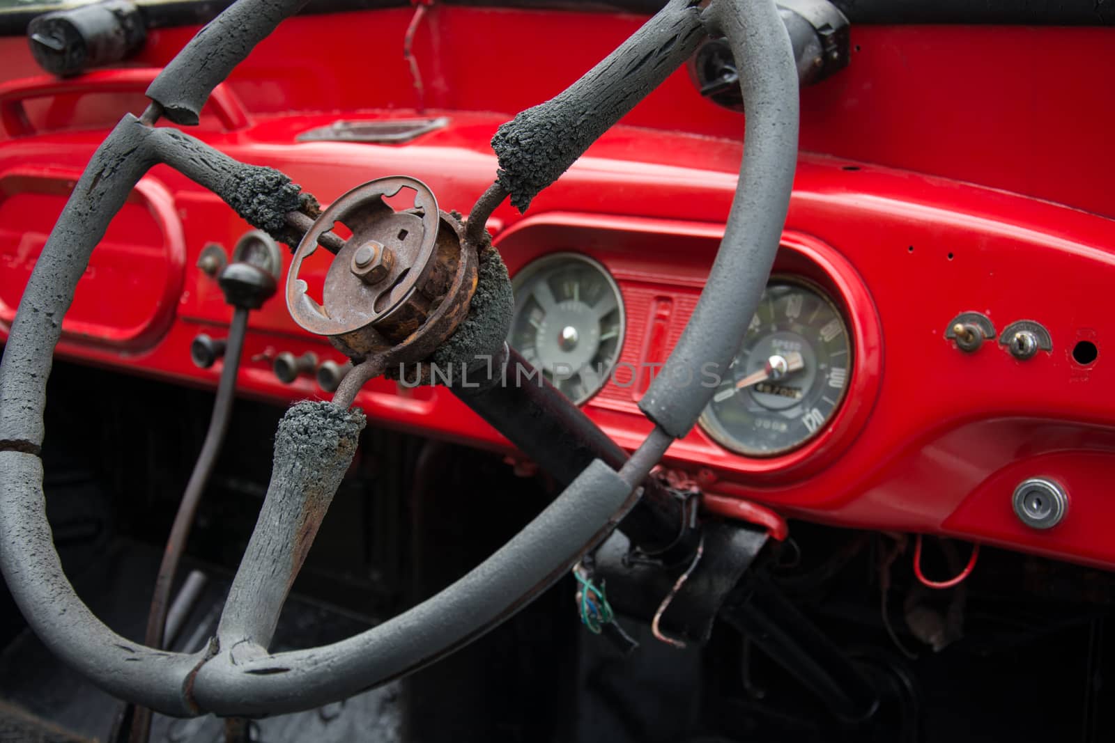 Steering wheel and dashboard in interior of old retro automobile. Processed by vintage or retro effect filter