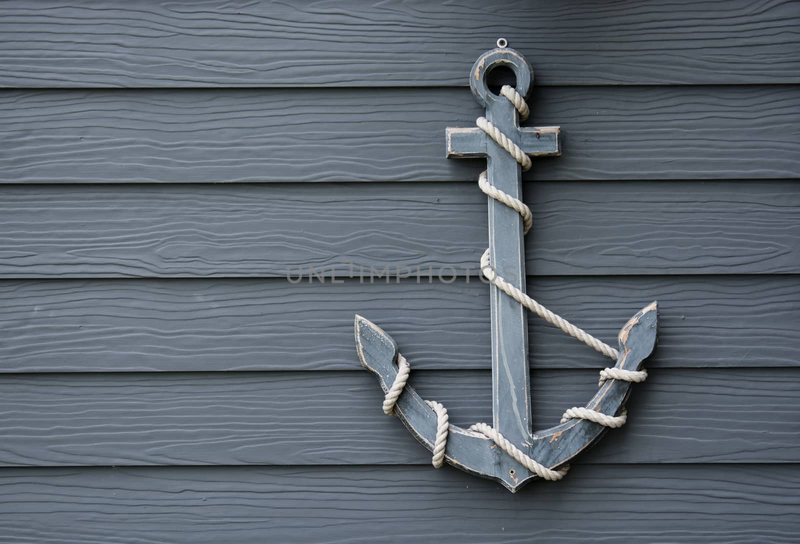 wooden anchor on wall vintage background