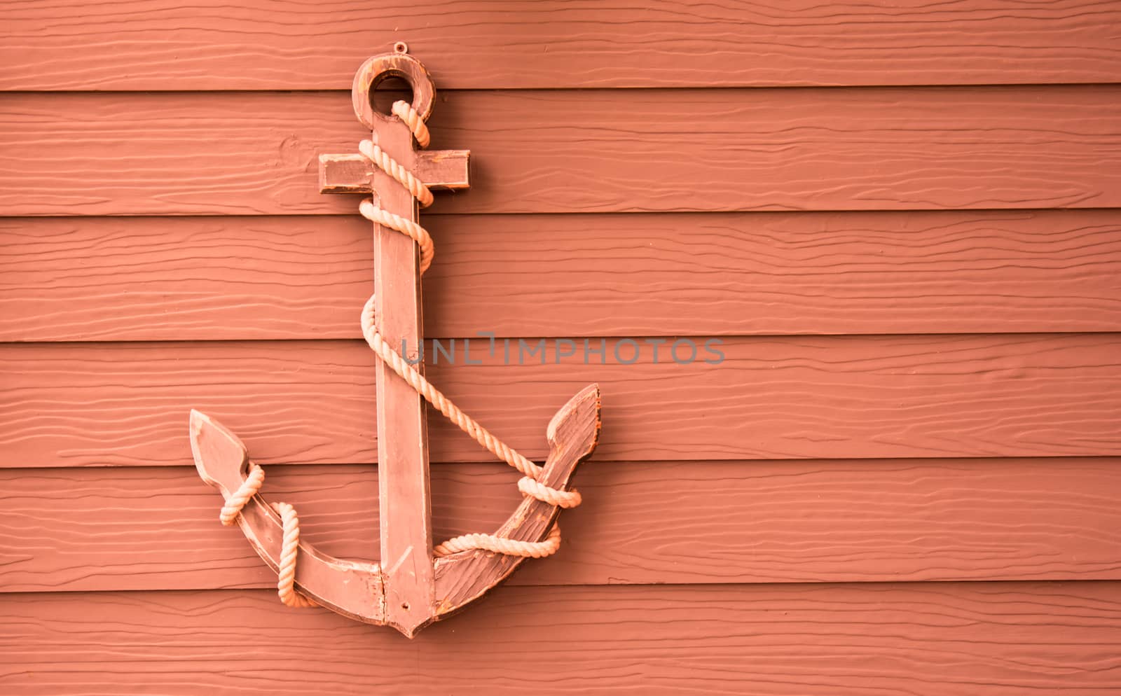 wooden anchor on wall vintage background