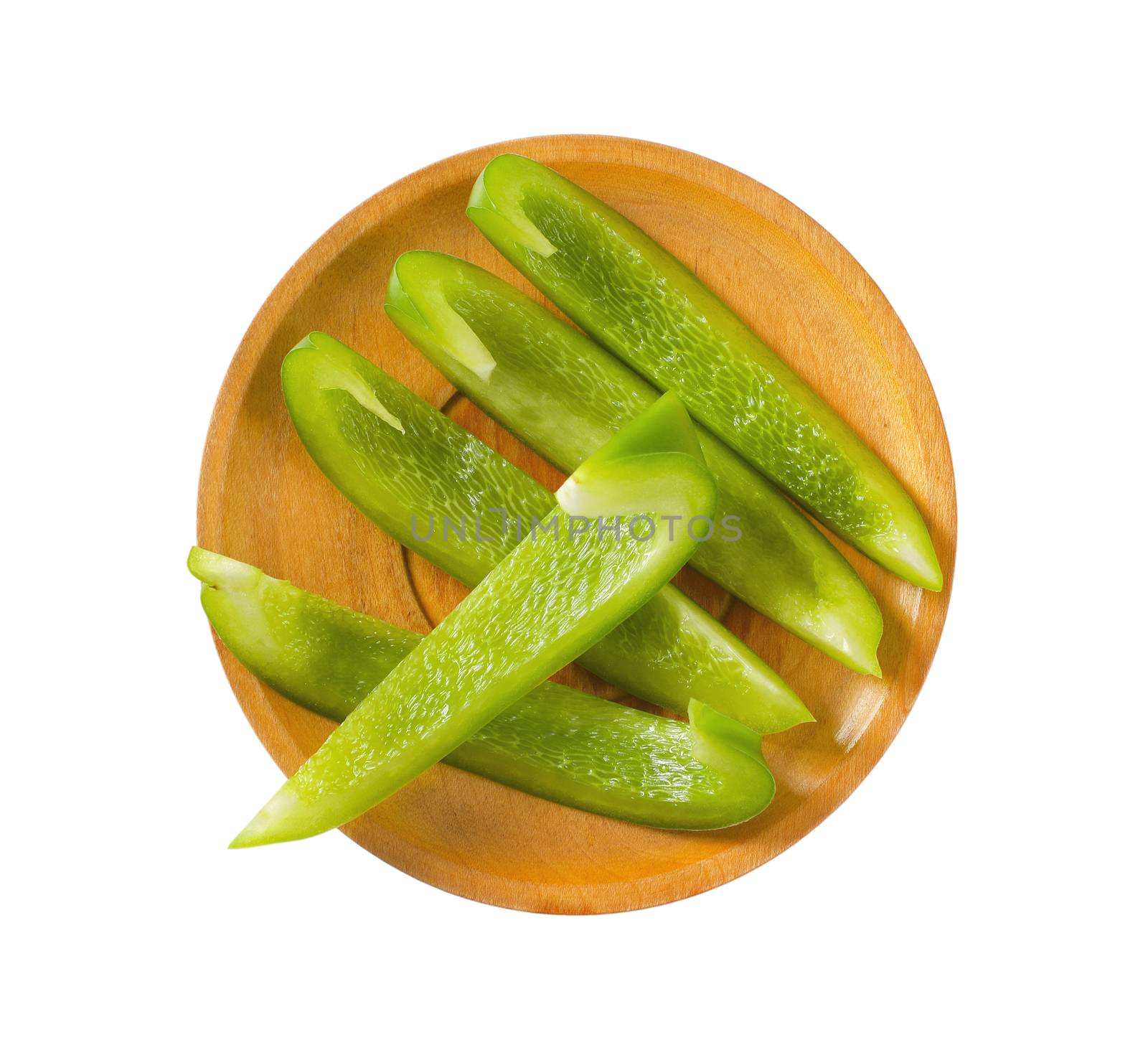 Slices of fresh green bell pepper on plate isolated on white