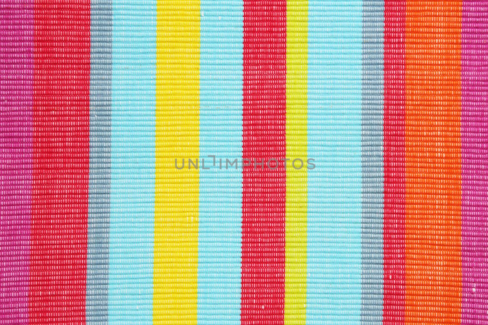 Colorful striped ribbed woven cotton place mat - background, full frame