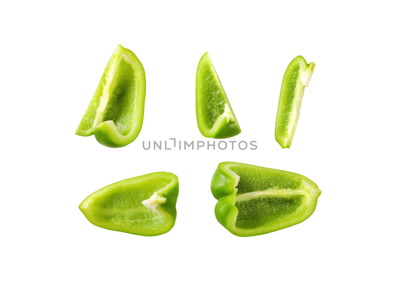 Green bell pepper cut into pieces isolated on white