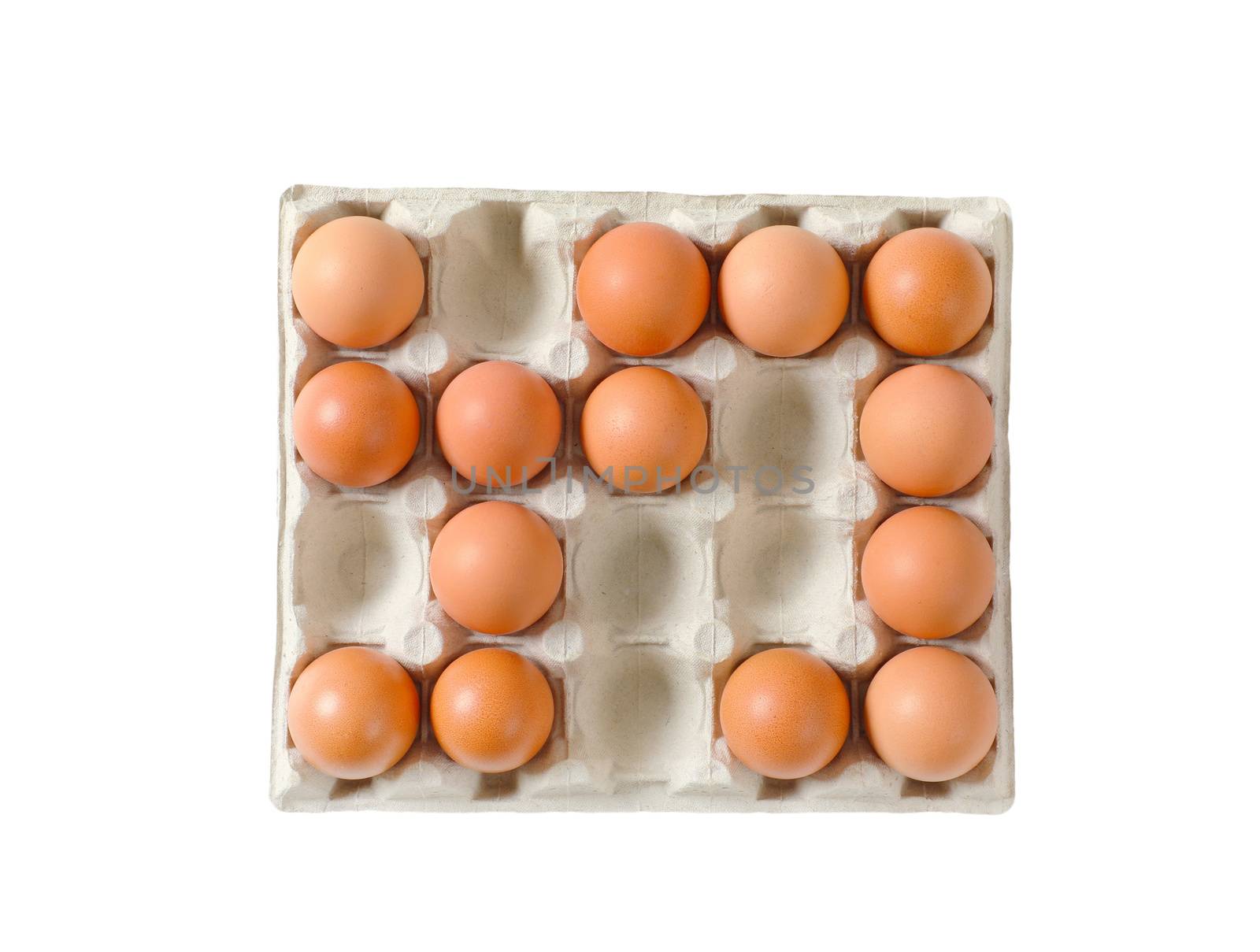 Fresh brown eggs in a twenty dimpled egg tray isolated on white