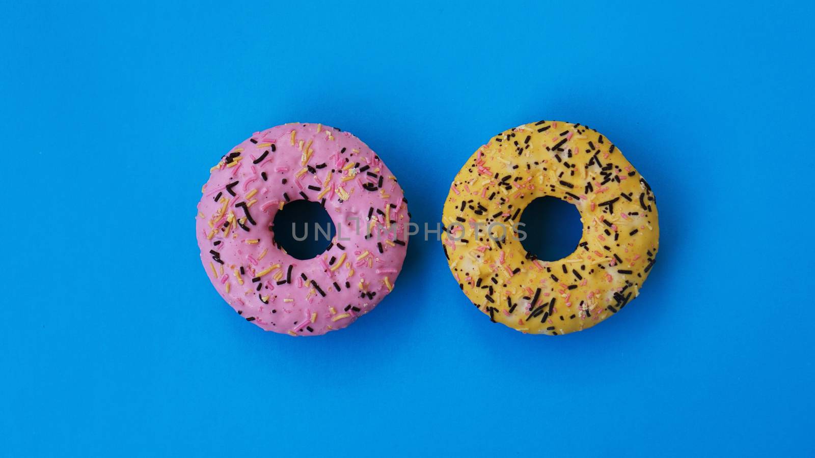 Two fashion round donuts. colorful minimalism concept. by natali_brill