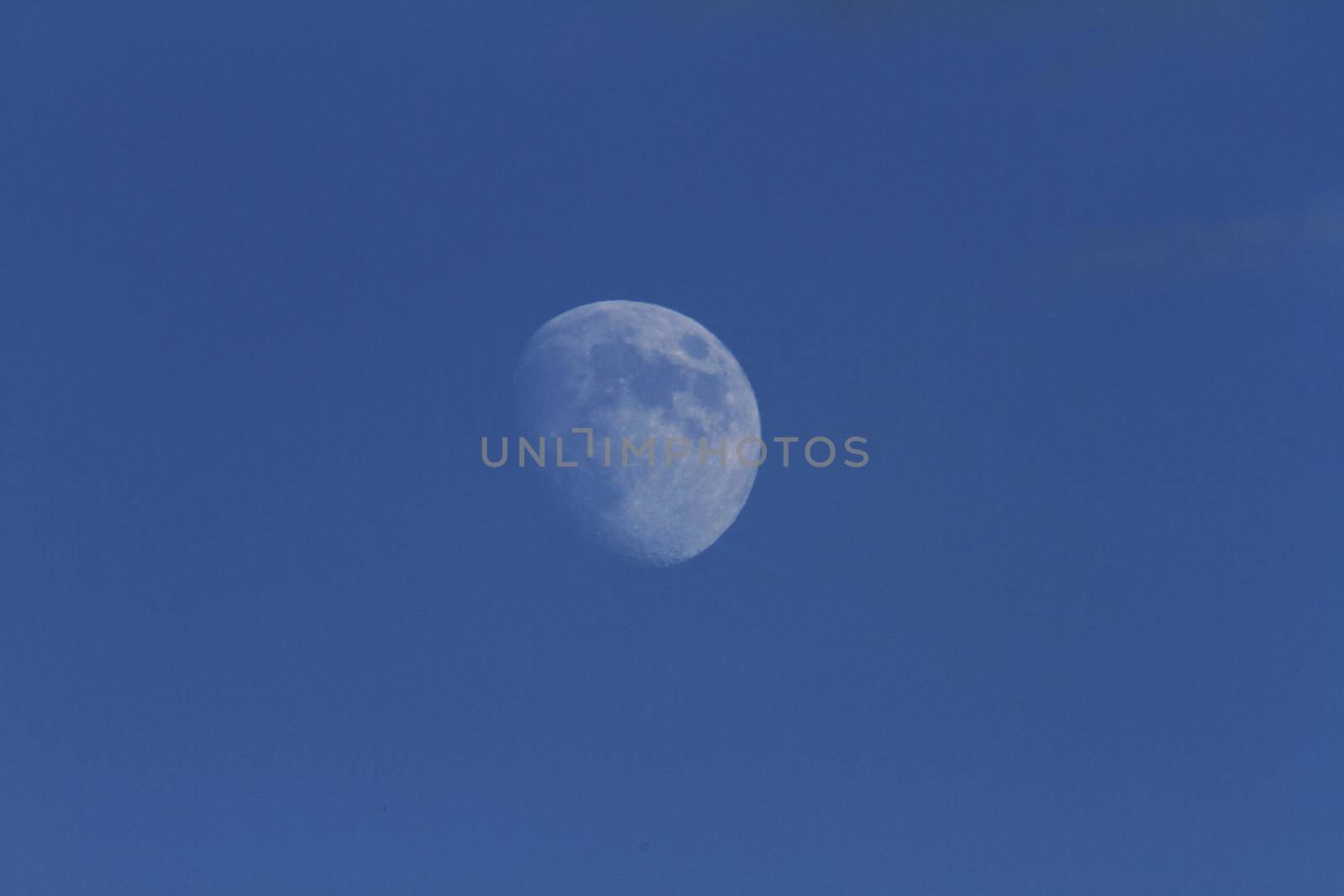 zoom moon in blue sky