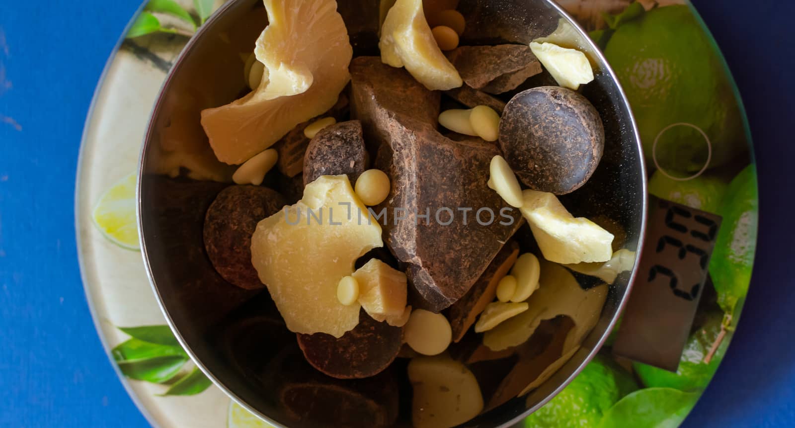 Broken pieces of dark bitter chocolate and white milk chocolate. Ingredients for home cooking of healthy sweets without sugar.