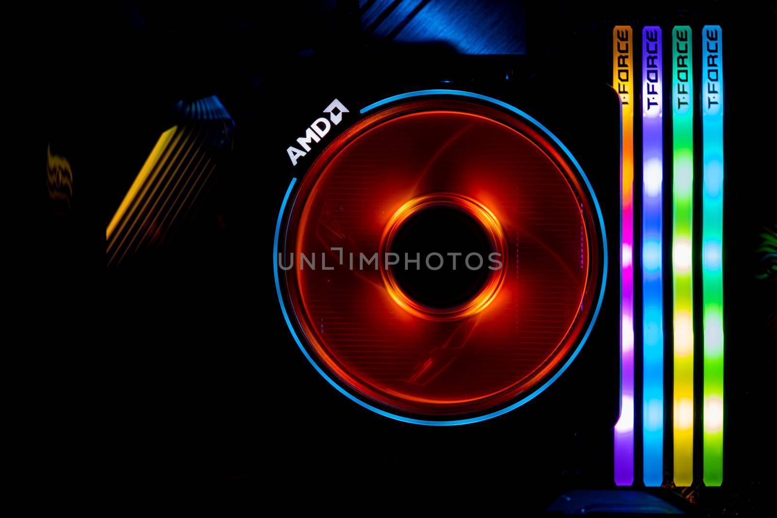 Chonburi, Thailand - MAY 16, 2020: The colorful of AMD Wraith Prism Cooler for CPU Ryzen 3900X with four T-Force DELTA RGB DDR4 DIMMs in the computer case.Chonburi, Thailand - MAY 16, 2020: The colorful of AMD Wraith Prism Cooler for CPU Ryzen9 3900X with four T-Force DELTA RGB DDR4 DIMMs in the computer case. by peerapixs
