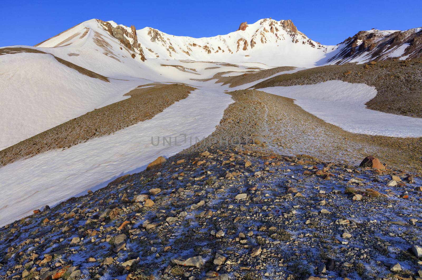 The picturesque path to the top of Mount Erciyes on a clear sunny day against a blue clear sky in central Anatolia, Turkey.