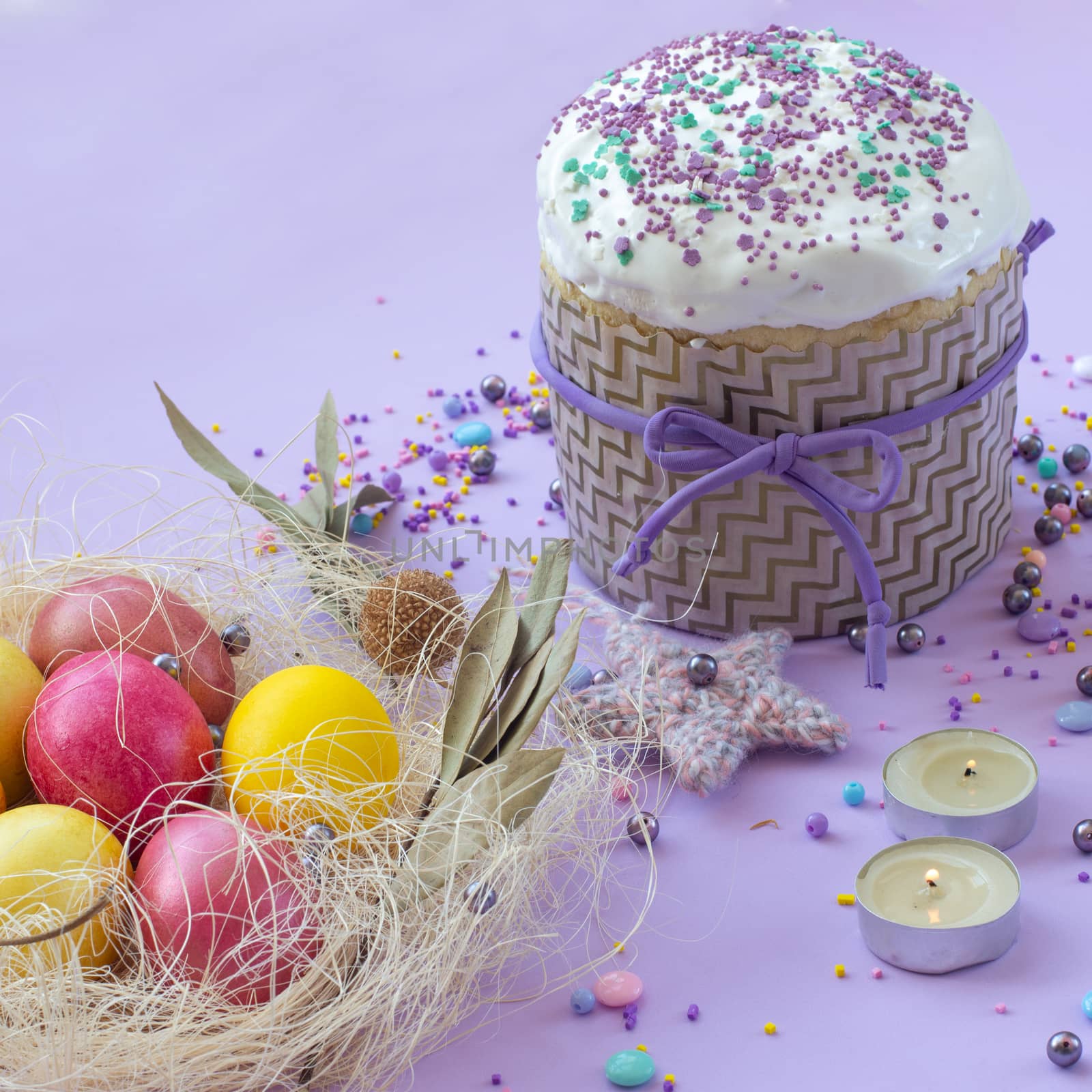 Easter cake and painted eggs beautifully decorated on a lilac background by Madhourse
