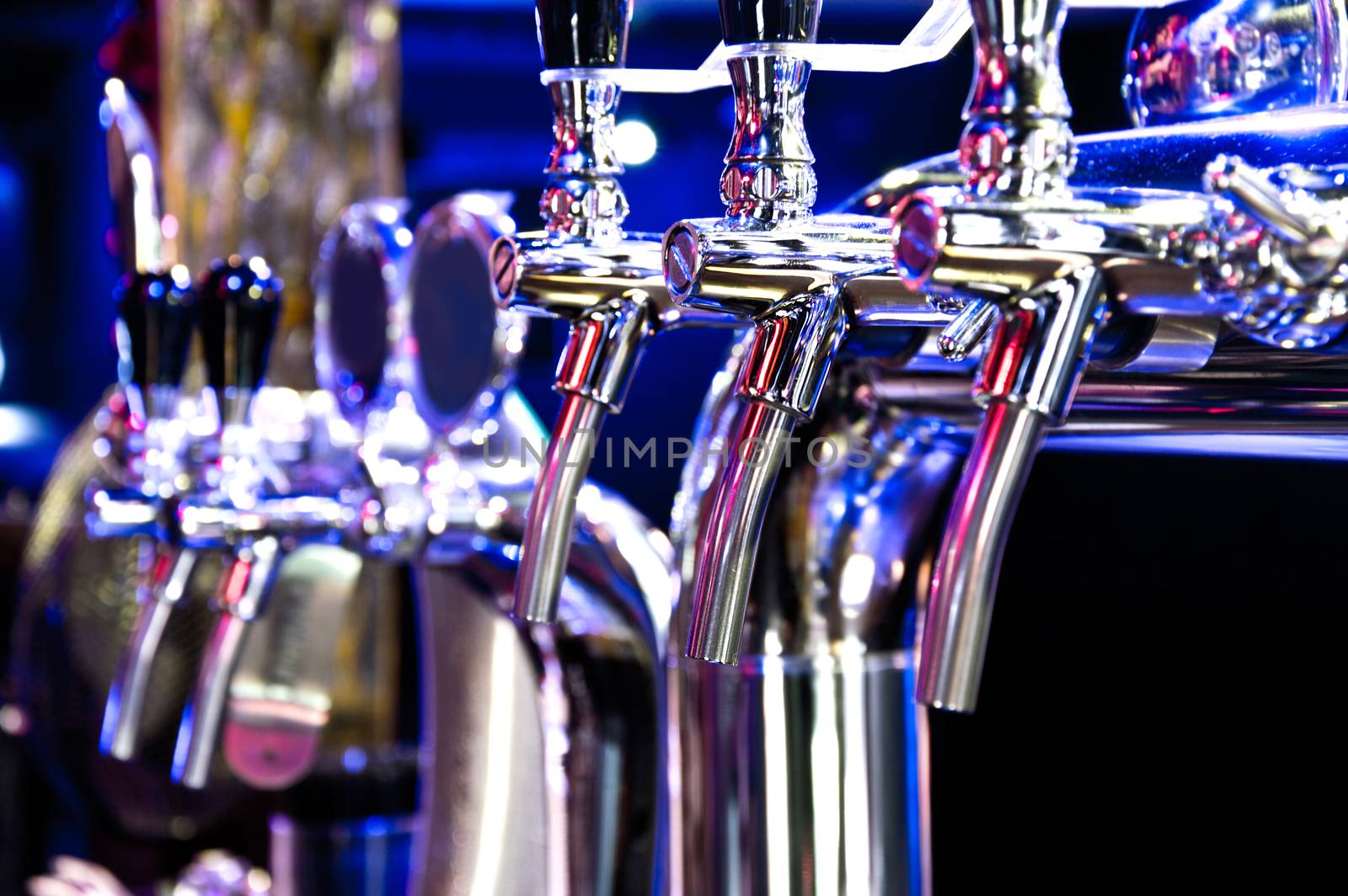 Alcohol conceptual image. Beer dispenser in the bar.