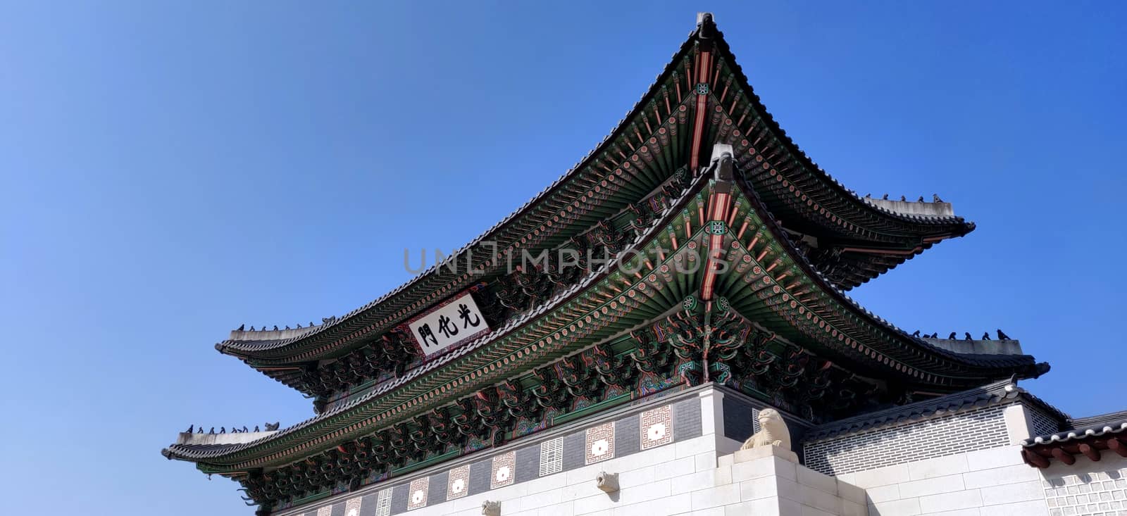 ancient Palace in Seoul, Korea against blue sky in bright day