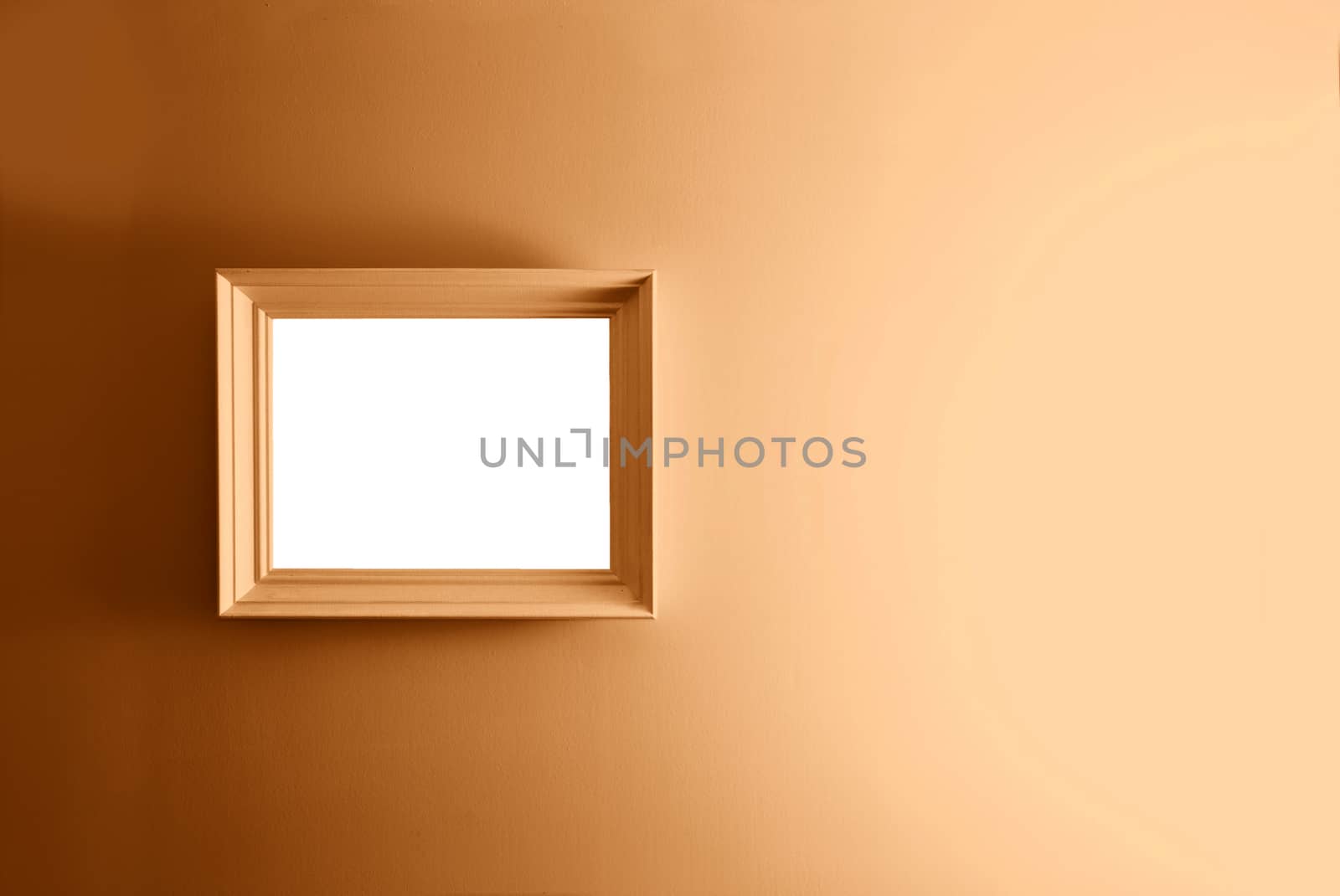 Empty frame on the brown wall. Free copy space.