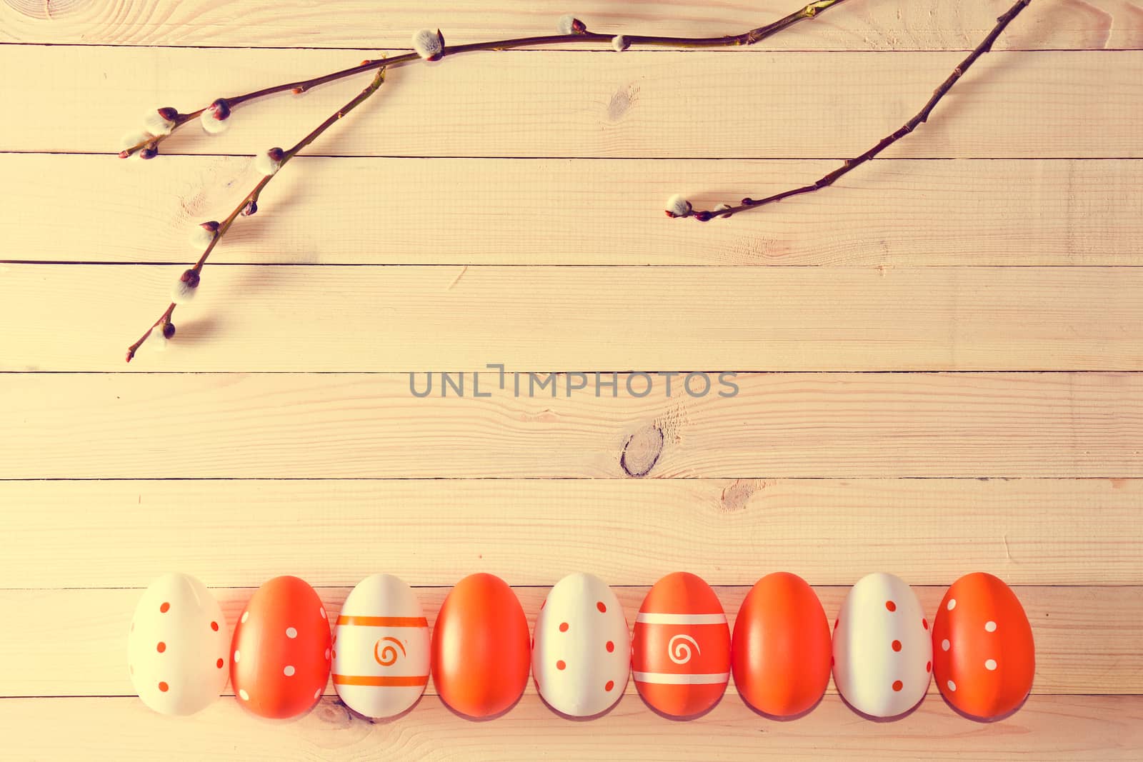 Easter eggs on wooden background. Soft vintage pastel colors picture.