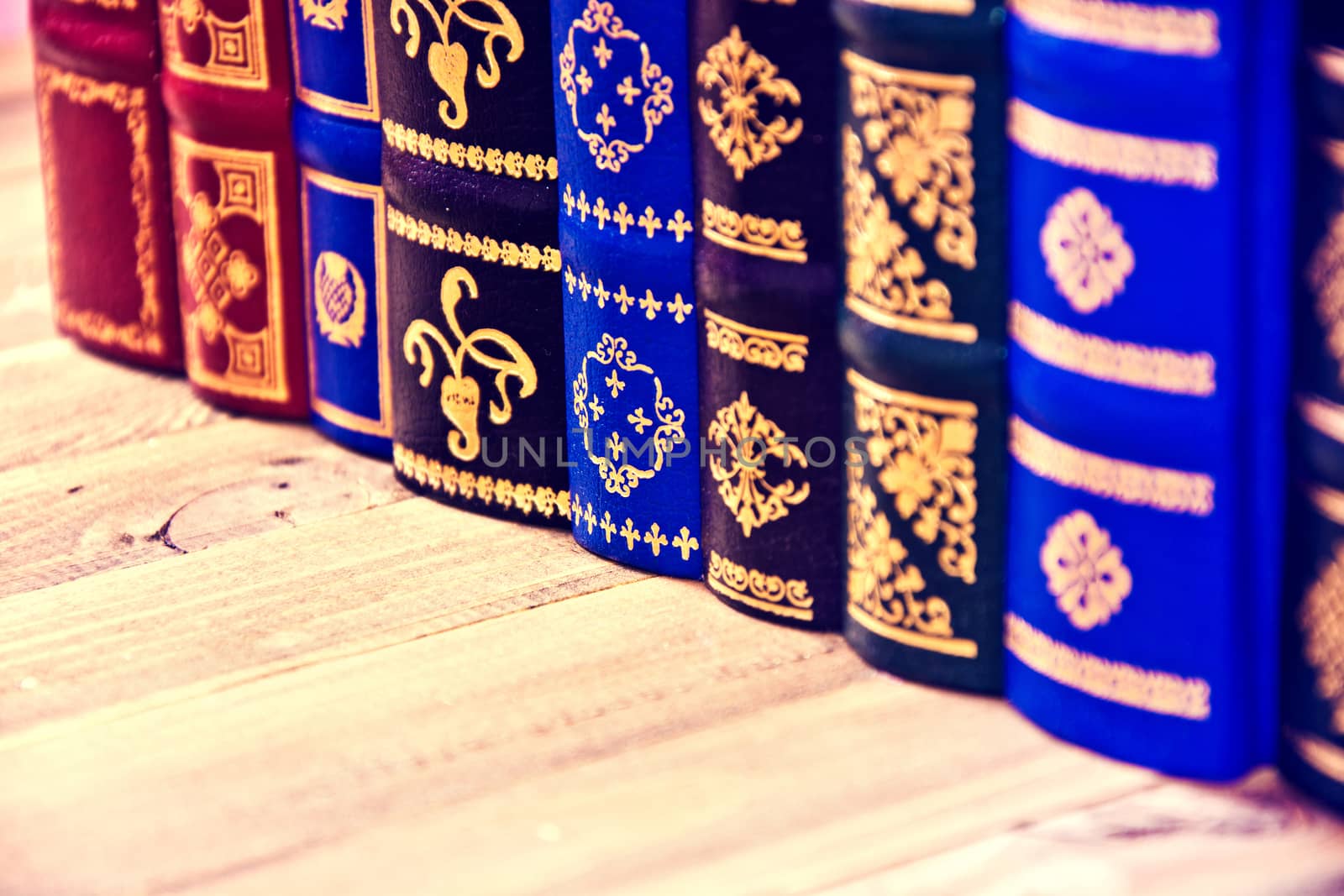 Old vintage retro books on the wooden table.