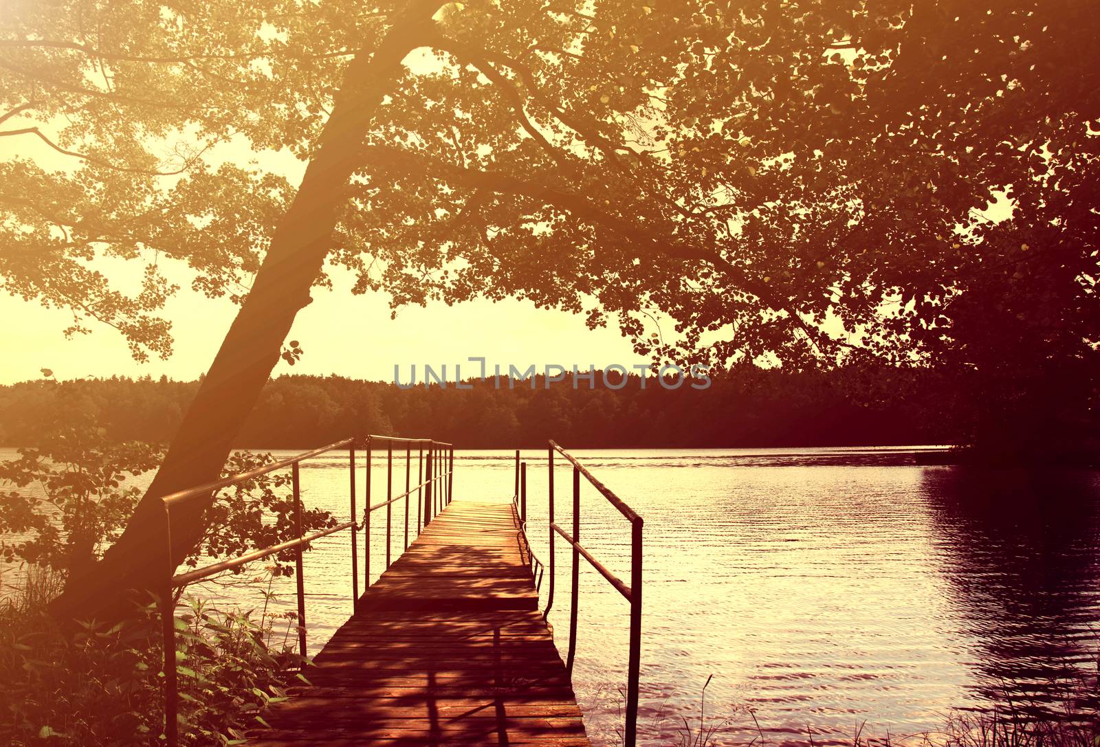 Evening on the lake at summer. Instagram vintage picture.