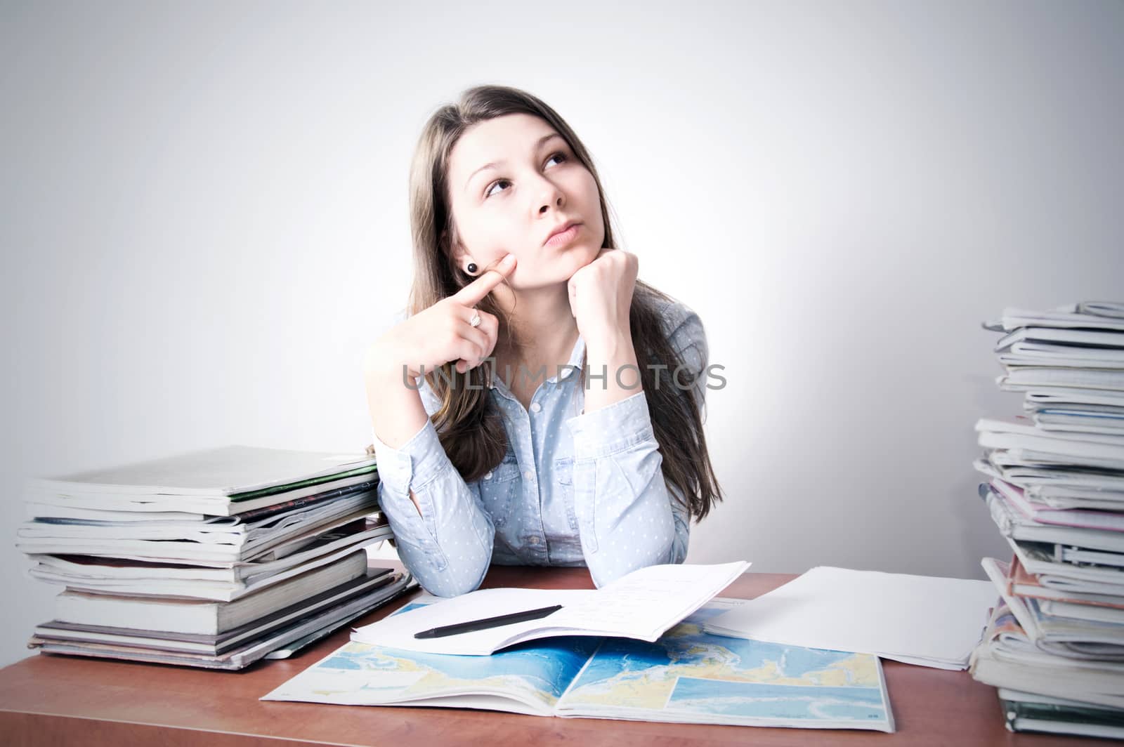 Cute smart young girl studying. Education conceptual image.