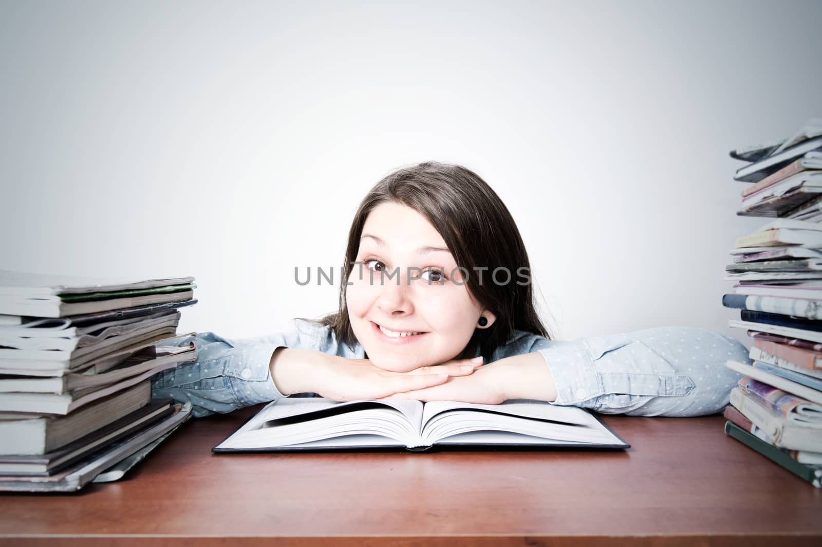 Cute smart young girl studying. by satariel