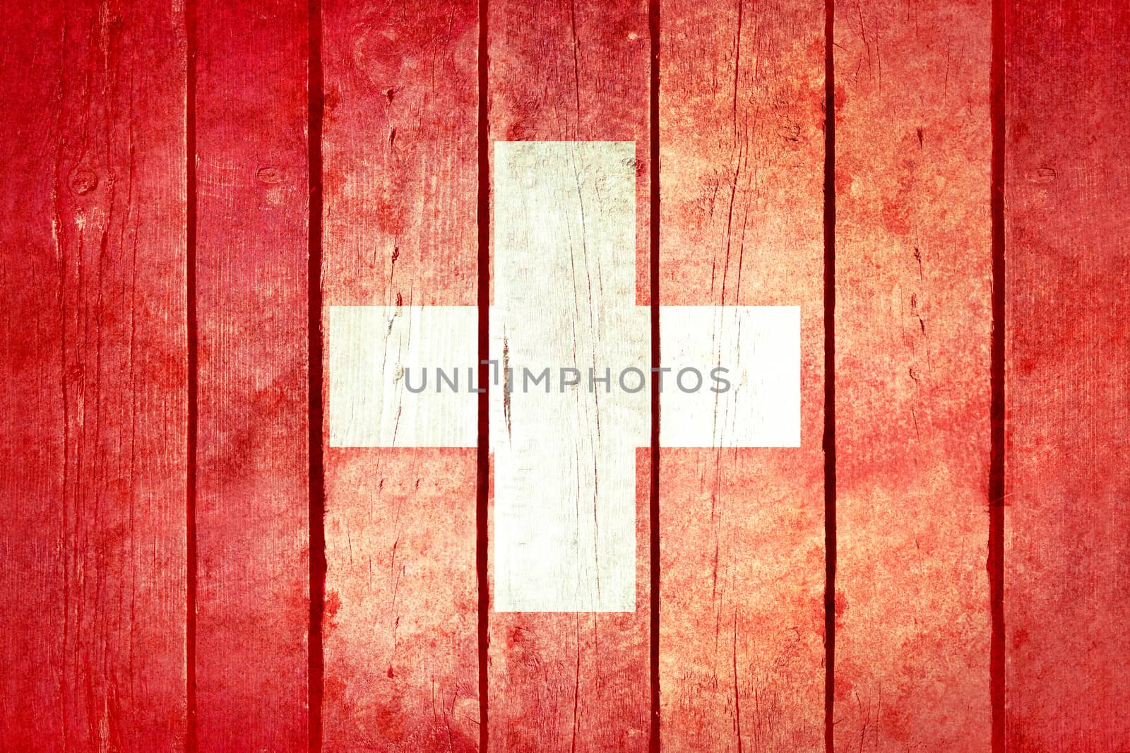 Switzerland wooden grunge flag. Switzerland flag painted on the old wooden planks. Vintage retro picture from my collection of flags.