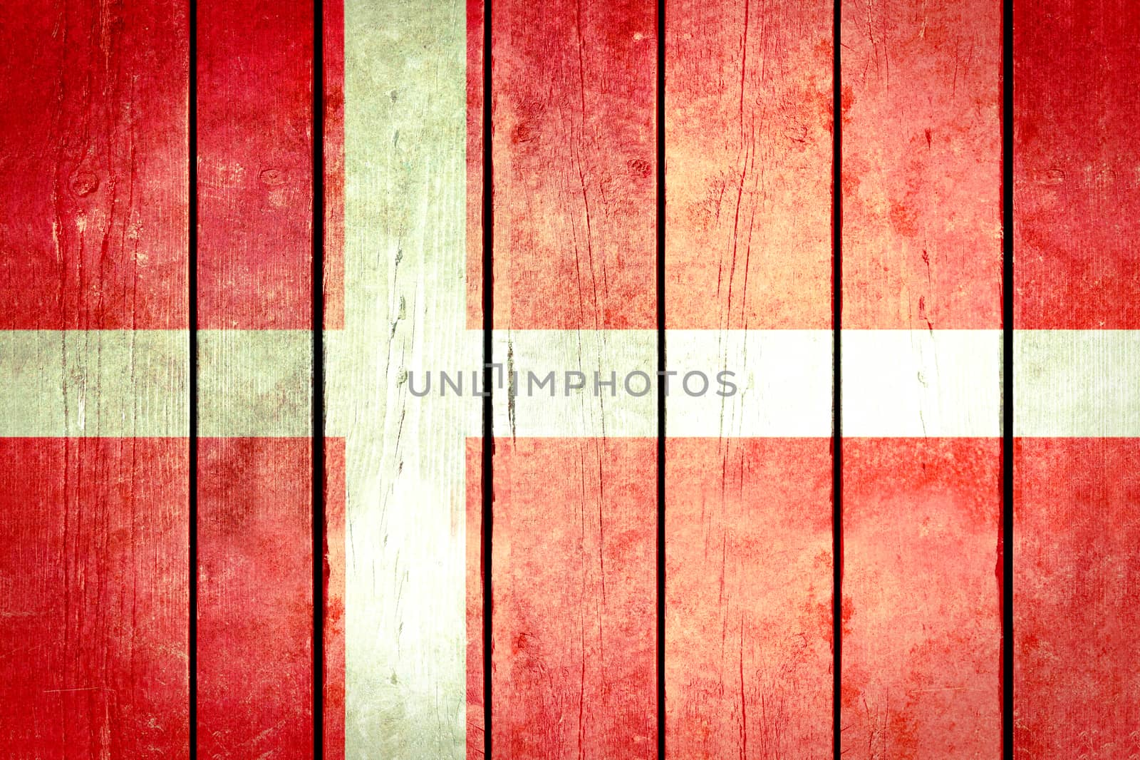 Denmark wooden grunge flag. Denmark flag painted on the old wooden planks. Vintage retro picture from my collection of flags.