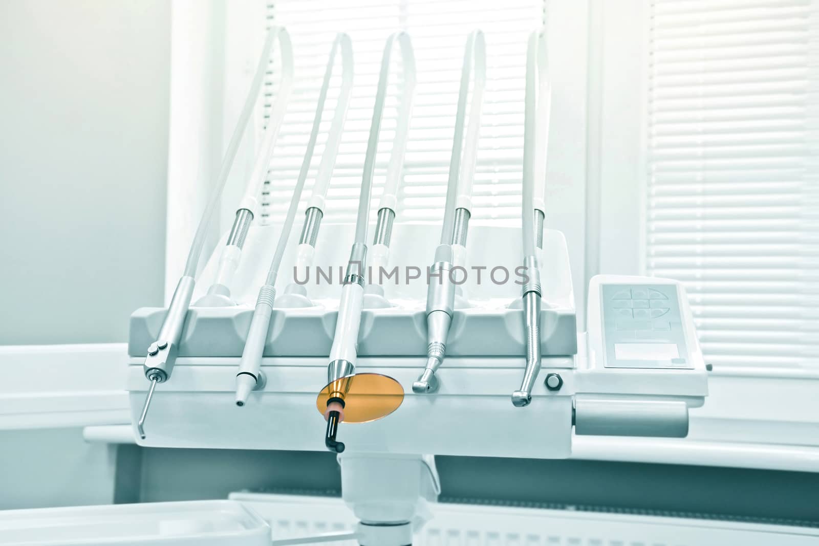 Professional Dentist tools in the dental office. Dental Hygiene and Health conceptual image.