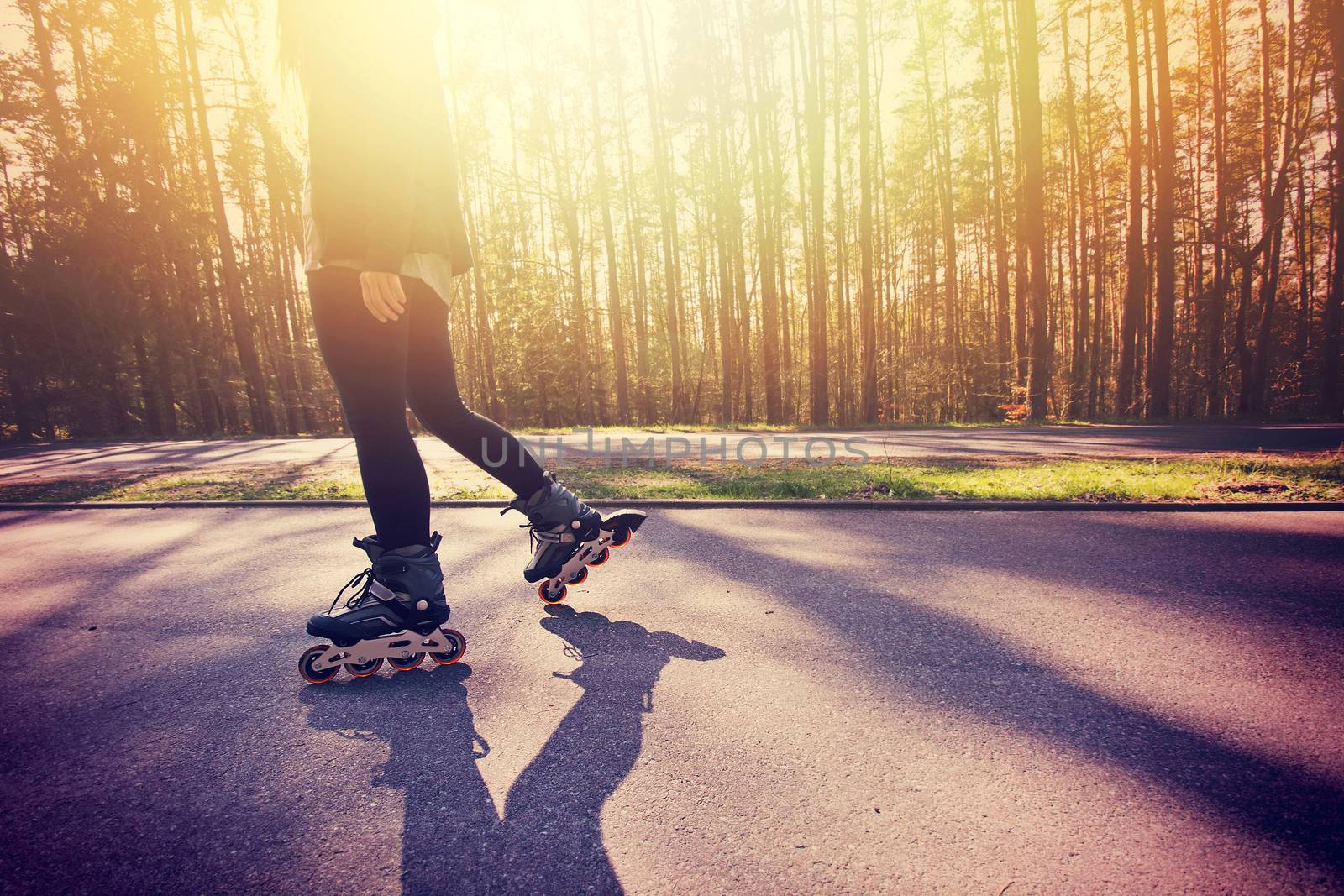 Teenage girl on roller skates at summer. by satariel