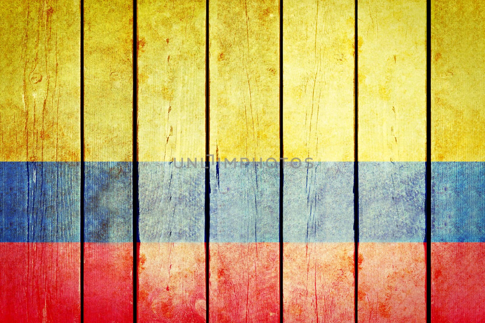 Colombian wooden grunge flag. Colombian flag painted on the old wooden planks. Vintage retro picture from my collection of flags.