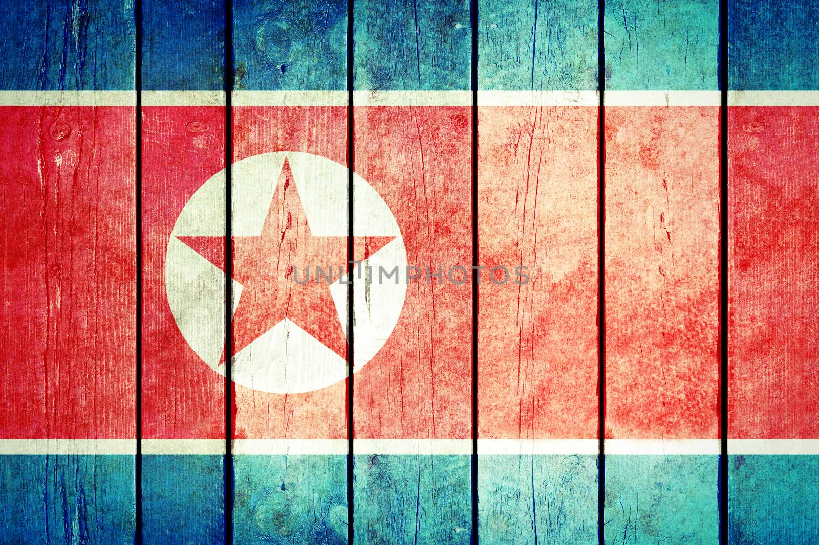 North Korea wooden grunge flag. North Korea flag painted on the old wooden planks. Vintage retro picture from my collection of flags.