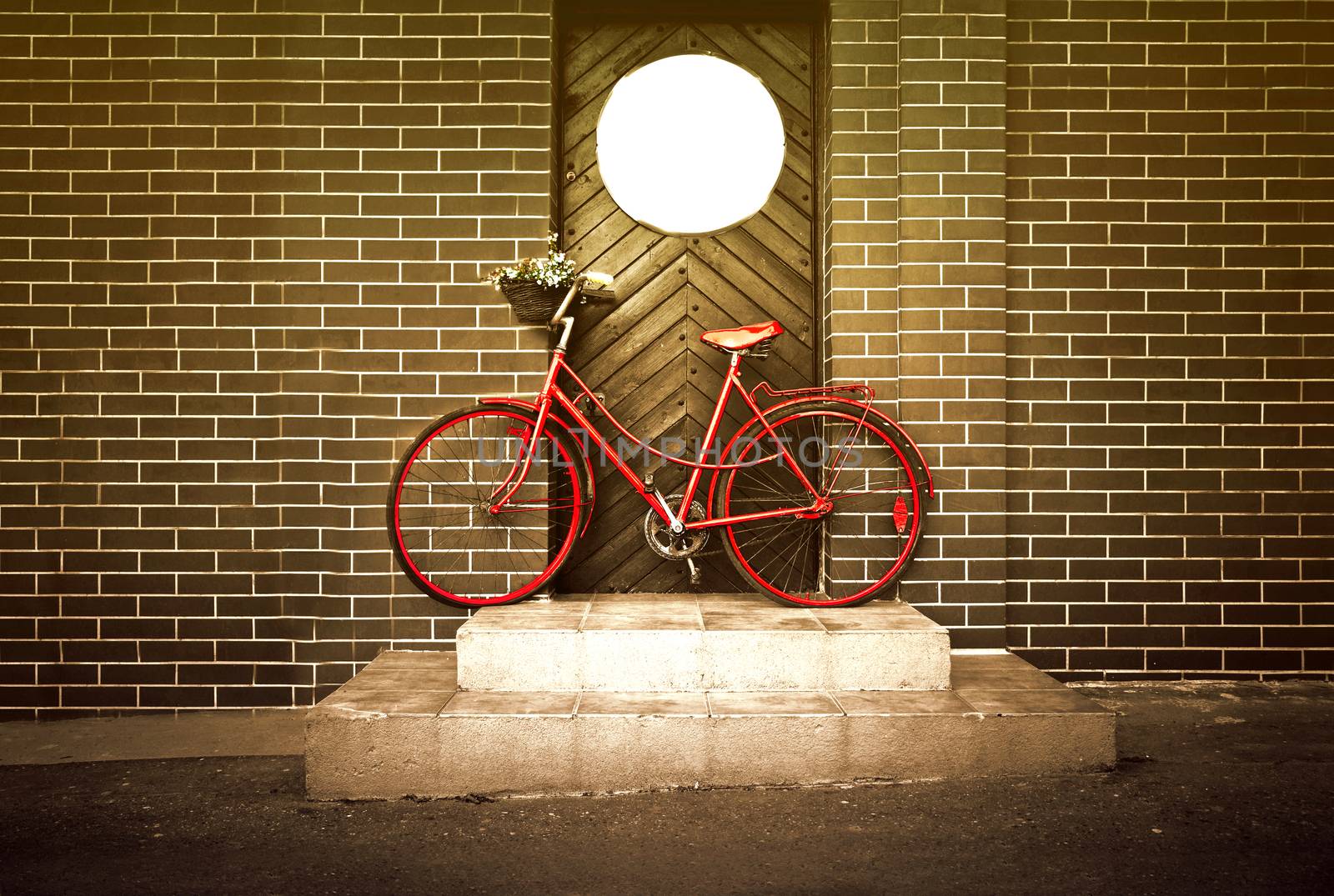 Vintage retro old red bike on the street. by satariel