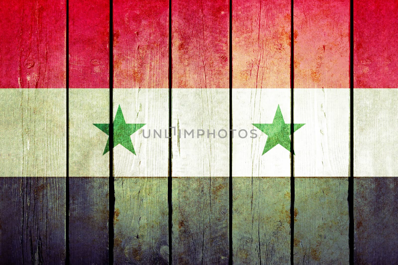 Syria wooden grunge flag. Syria flag painted on the old wooden planks. Vintage retro picture from my collection of flags.