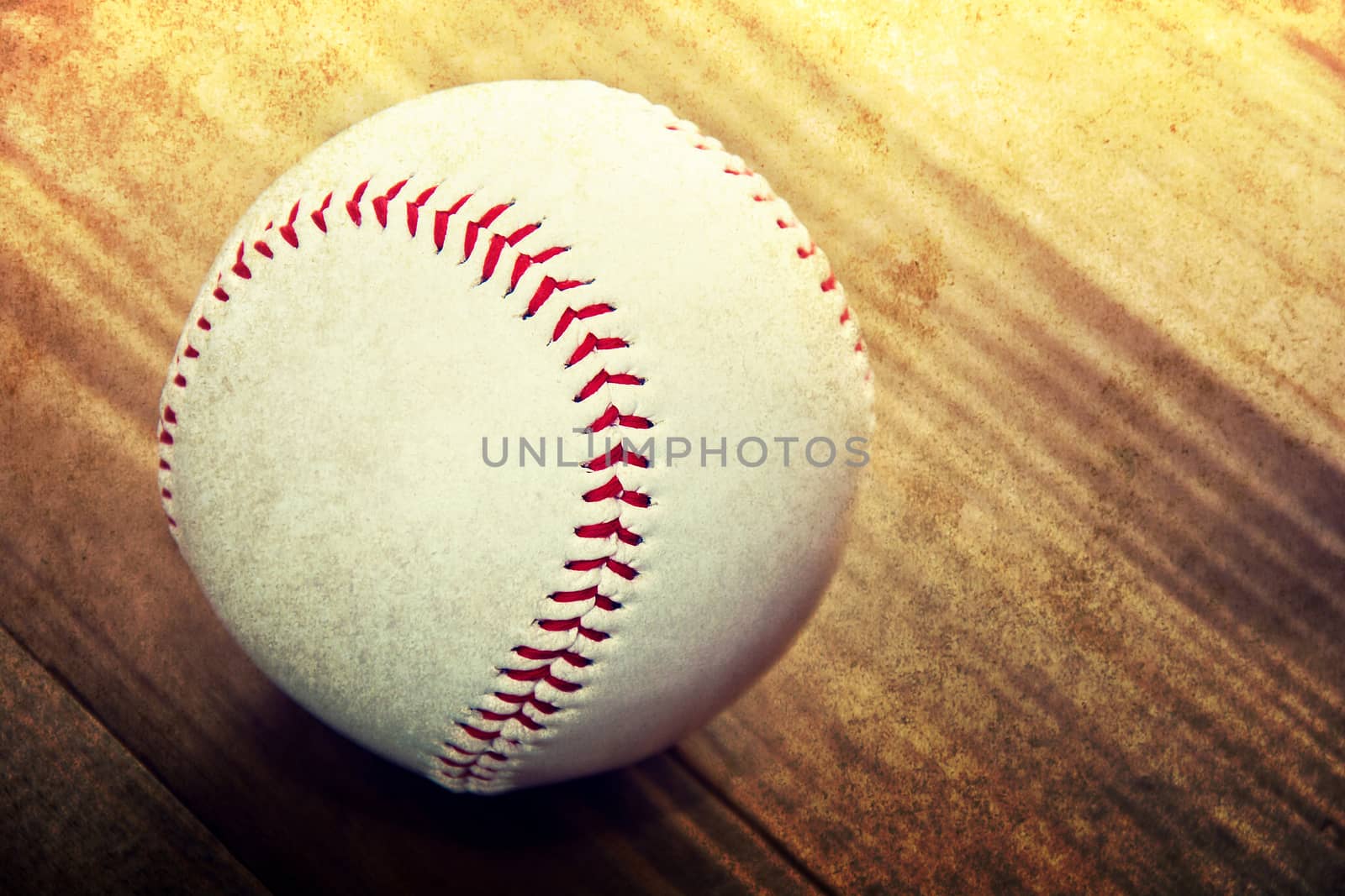 Baseball game. Baseball ball on wooden background. Grunge picture.