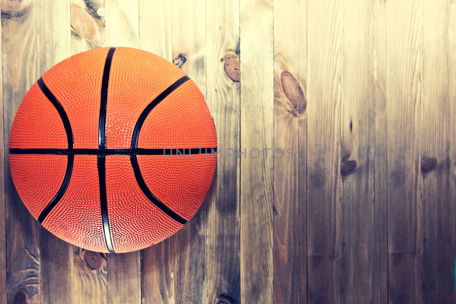 Basketball ball on wooden hardwood floor. by satariel